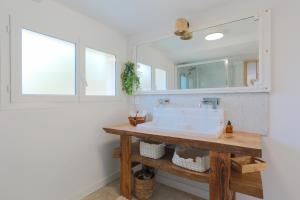 a bathroom with a sink and a mirror at Villa Les Agapanthes in Paimpol +32 photos