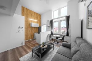a living room with a couch and a table at Furano Resort Wakaba D in Furano +90 photos