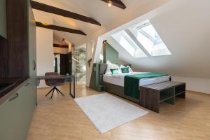 a bedroom with a bed and a desk and a window at Mattiqo Hotel - Modern & Zentral & Free Parking & 24h Self Check-In in Mattighofen +23 photos