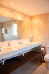 a bathroom with a large sink and a mirror at Casa Estelle - cozy with lovely garden - Mijas - Riviera del Sol in Mijas Costa