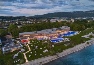 an aerial view of a building next to the water at Hotel Alte Schule in Lindau
