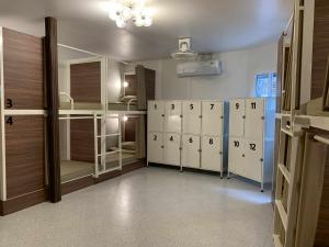 a room with several lockers and a room with a room at 99 hostel in Ko Tao