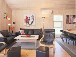 a living room with a couch and a table at Luxury Spa Retreat in Marielyst - By Traum Ferienwohnungen in Marielyst