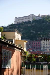 a city with a large building on a hill at Camera Con Vista Apartments in Naples