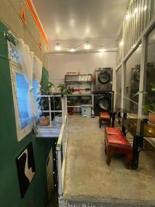 a living room with a couch and a table at The Market House in Da Lat +9 photos