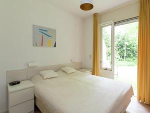Ένα ή περισσότερα κρεβάτια σε δωμάτιο στο Holiday Home near Lemelerberg Nature Reserve