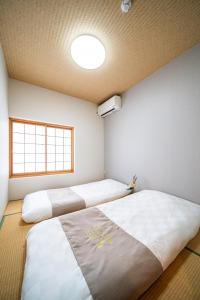 Ένα ή περισσότερα κρεβάτια σε δωμάτιο στο 夏様小倉町 Convenient house, private house, 5-minute walk from Nijo station