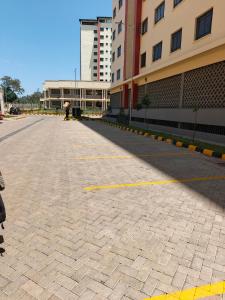 an empty street in front of a building at Okoko Enterprises BnB in Kisumu