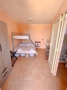 a bedroom with a bunk bed in a room at Casa Vacanze Da Angy & Gio in Grisolia