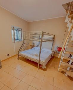 a bedroom with a bunk bed and a staircase at Casa Vacanze Da Angy & Gio in Grisolia