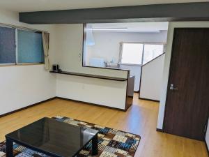 an empty room with a table and a door at Amami North Mangrove Inn - Vacation STAY 90032v in Amami