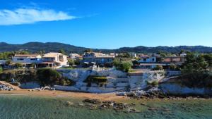 a view of a beach with houses at Dip in the blue - 2 in Agios Georgios
