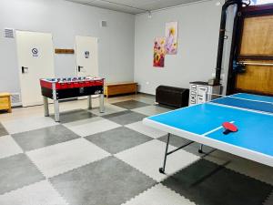 a room with a ping pong table and a ping pong ball at Affittacamere La Grotta Magica in Venagrande