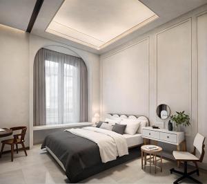 a bedroom with a large bed and a table and chairs at Qingfeng B&B in Guangzhou