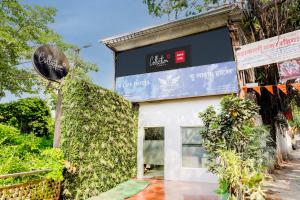 a building with a sign on the side of it at Super Collection O Ulife in Mumbai +33 photos