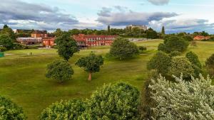 an aerial view of a park with trees and a building at Windmill Village Hotel, Golf Club & Spa, BW Signature Collection in Coventry