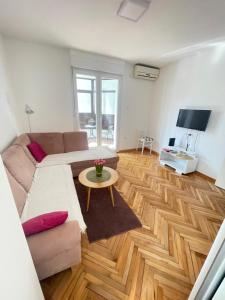 a living room with a couch and a table at Apartman PARK in Trebinje