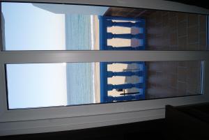 a window in a room with a view of a building at Hotel Doña Luisa in San Luis de Sabinillas