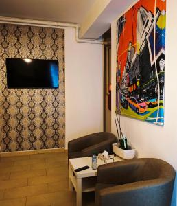 Μια τηλεόραση ή/και κέντρο ψυχαγωγίας στο Sealife Suites Aleri