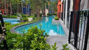 a swimming pool in the middle of a building at Cabanas Huahin by PTA in Hua Hin +6 photos