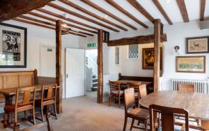 a dining room with a table and chairs at The Rose & Crown, Ashbury in Ashbury