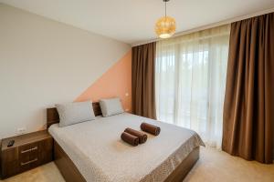 a bedroom with a bed with a pillow on it at The Boulevard Luxury Apartment 3 in Sofia