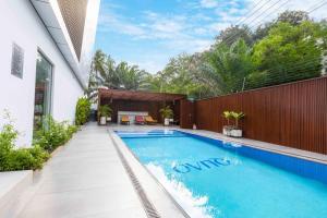 a swimming pool in the backyard of a house at 233 Boulevard by QUAO REALTY in Accra