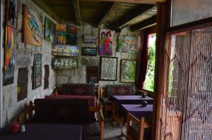 a living room filled with furniture and a table at Stay In Peace Cave Hostel in Göreme
