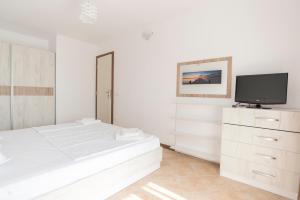 Postel nebo postele na pokoji v ubytování Oasis Resort & Spa Cozy Apartments