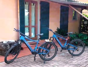 two bikes parked in front of a house at Residence Mugello Resort in Scarperia