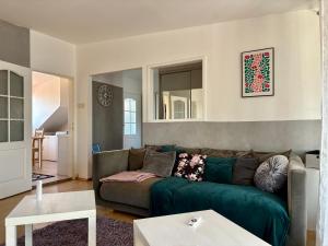 a living room with a couch and a table at Oldtown Magic Cityhub in Bratislava