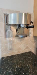 a pot on top of a counter in a kitchen at Beach & Palms condo in South Padre Island
