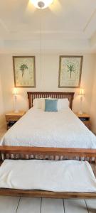 a bedroom with a large bed with two night stands at Beach & Palms condo in South Padre Island +85 photos