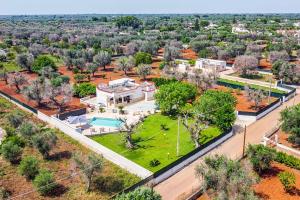 an overhead view of a sprawling estate with a pool at Villa Aranceto by Villa Plus in San Vito dei Normanni