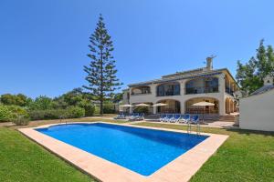 a swimming pool in front of a house at Jasmin by Aguilarent in Jávea