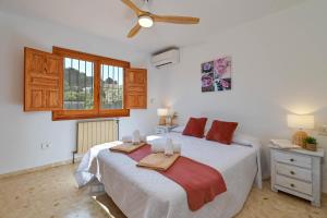 a bedroom with a bed with two towels on it at Jasmin by Aguilarent in Jávea +18 photos