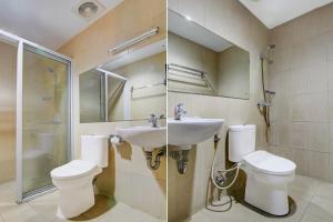 プカンバルにあるCollection O Stefani City Hotelの洗面台、トイレ、鏡のあるバスルーム +33枚の写真