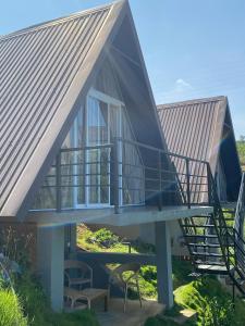 a house with a metal roof and a staircase at Twin Green in Hatton