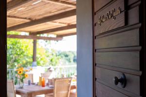 a door to a patio with a table and chairs at La Casa dei Quadri in Ravi