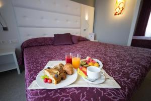 Postel nebo postele na pokoji v ubytování Hotel Al Cigno