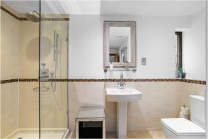 a bathroom with a sink and a glass shower at Bracken Ground in Coniston +12 photos