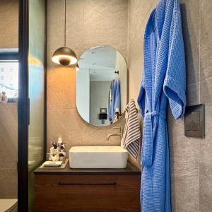 a bathroom with a sink and a mirror at Rooftop House Seongsu in Seoul