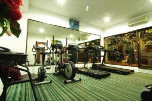 a gym with several exercise equipment in a room at CM Night Bazaar Boutique Hotel - โรงแรม ซี เอ็ม ไนท์บาซาร์ บูทีค in Chiang Mai