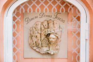 a bust of a woman on a wall at Dimora Donna Teresa in Positano