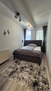 Un pat sau paturi într-o cameră la Be Chill Apartment