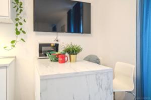 Kuchyň nebo kuchyňský kout v ubytování GuestHost - Casa Amiga Lovely Studio + 18 fotografií