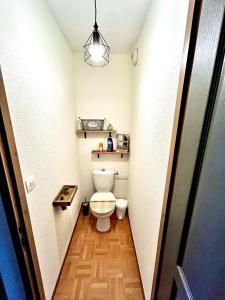 a small bathroom with a toilet in a hallway at Bel Appartement 6 personnes au pied des pistes in Chamrousse +5 photos