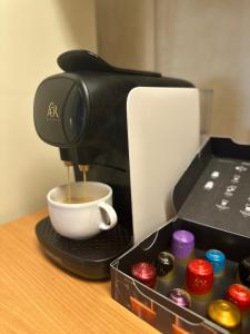 a coffee maker is making a cup of coffee at Nomad Haux in the heart of Tossa 7 in Tossa de Mar +20 photos