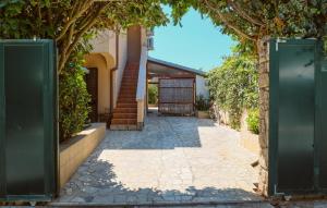 an entrance to a house with a stone walkway at 1 Bedroom Stunning Apartment In Artatore in Cunski +17 photos