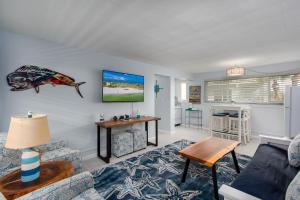 a living room with a couch and a table at Tropic Terrace Suite #29 - Beachfront Resort in St Pete Beach